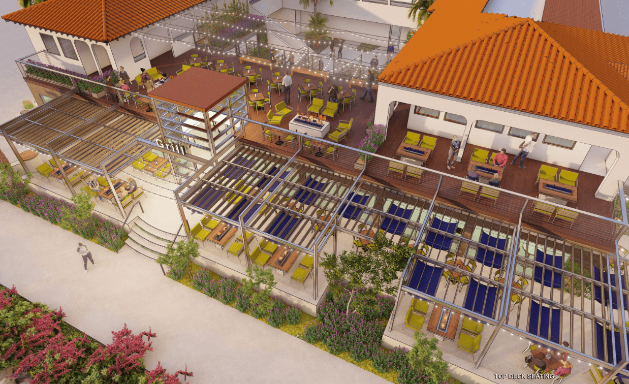 Aerial view of a restaurant with outdoor seating under pergolas and indoor seating, surrounded by plants and flowers.